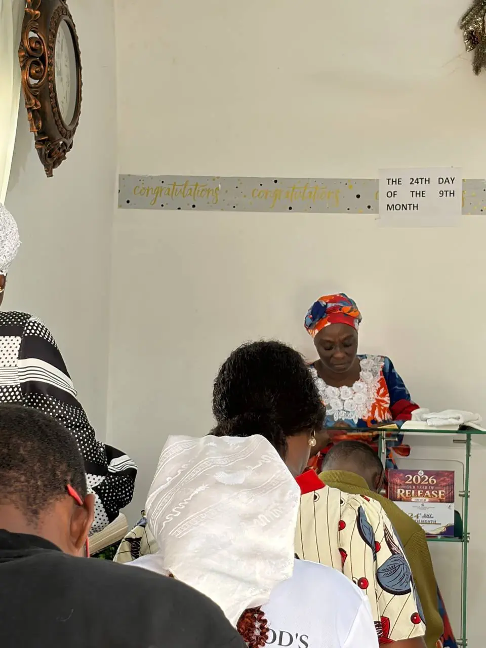 A minister at the pulpit leading the congregation